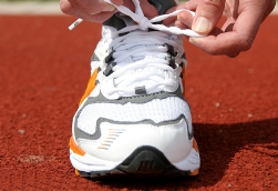 image of person tying a running shoe